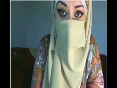 Beautiful Arab BBC harlot reveals her big melons while covering her face.
